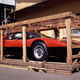 A Ferrari 365 GT4 BB imprisoned in a cruel wooden cage. A car should not be in a cage. A car should be on a road, driving. Photo: Ferrari